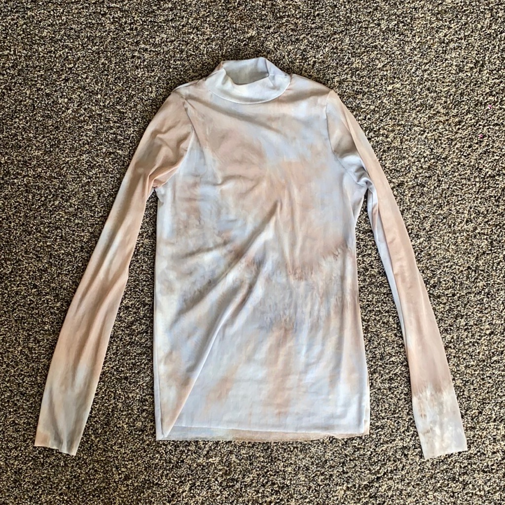 A long-sleeve mesh top photographed for a US resale listing in September 2026